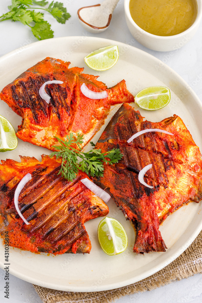 Tandoori Pomfret Fish, Popular Indian Seafood Dish, Top Down Vertical Photo
Tandoori Pomfret Fish, Popular Indian Seafood Dish, Top Down Vertical Photo