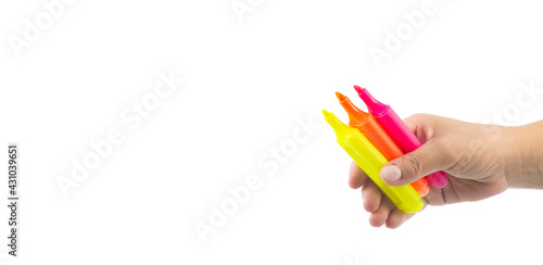 female hand holding various colored markers