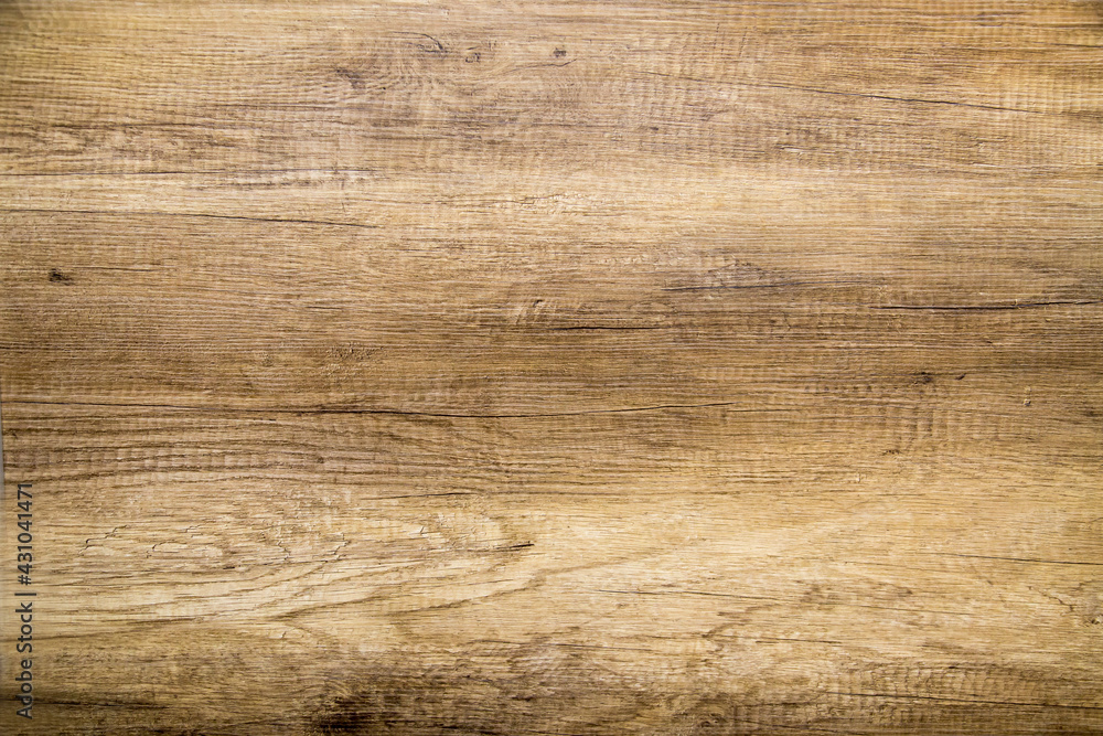 Obraz premium The background is made of natural brown oak boards with beautiful knots and a pattern of the tree structure. Design backgrounds textures construction.