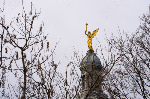 A golden angel with a torch
