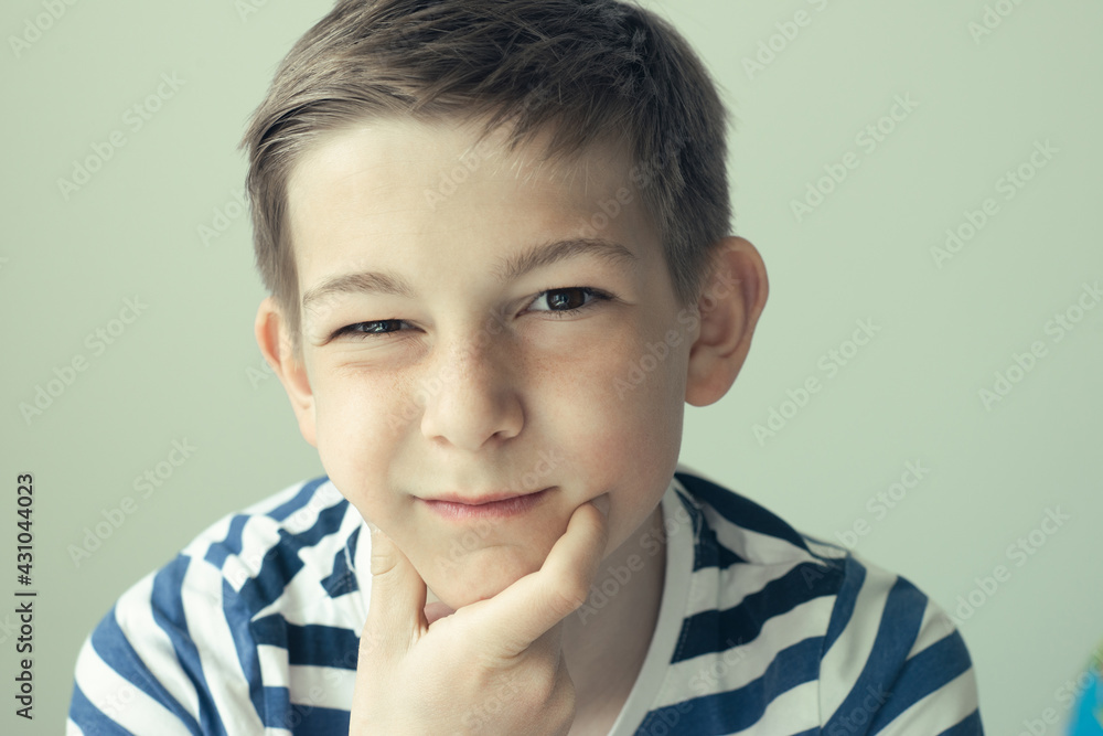 Portrait of handsome boy posing on white wall background Portrait of handsome boy posing on white wall background