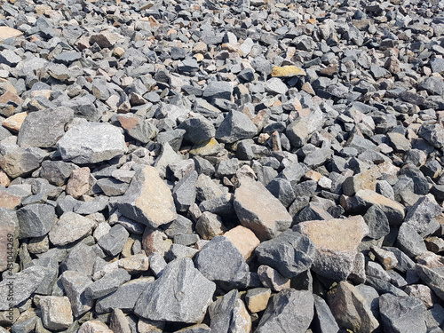 Background of broken stones close-up. Broken gravel texture