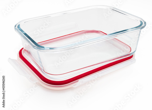 Empty and open glass tupperware. Isolated on white background.