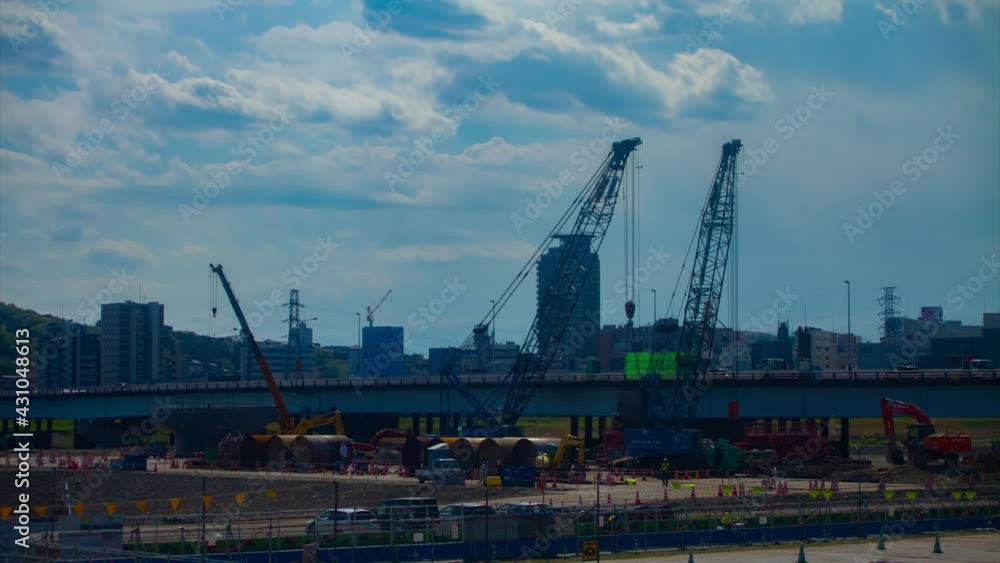 A timelapse of moving cranes at the under construction daytime A timelapse of moving cranes at the under construction daytime