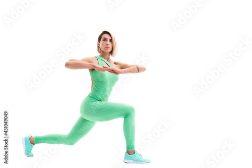 full body portrait of young sporty woman stretching before exerc
