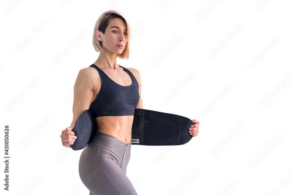 Girl doing fitness back belt slimming isolated on white backgrou Girl doing fitness back belt slimming isolated on white backgrou