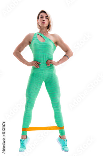 Woman exercising fitness resistance bands in studio silhouette i photo