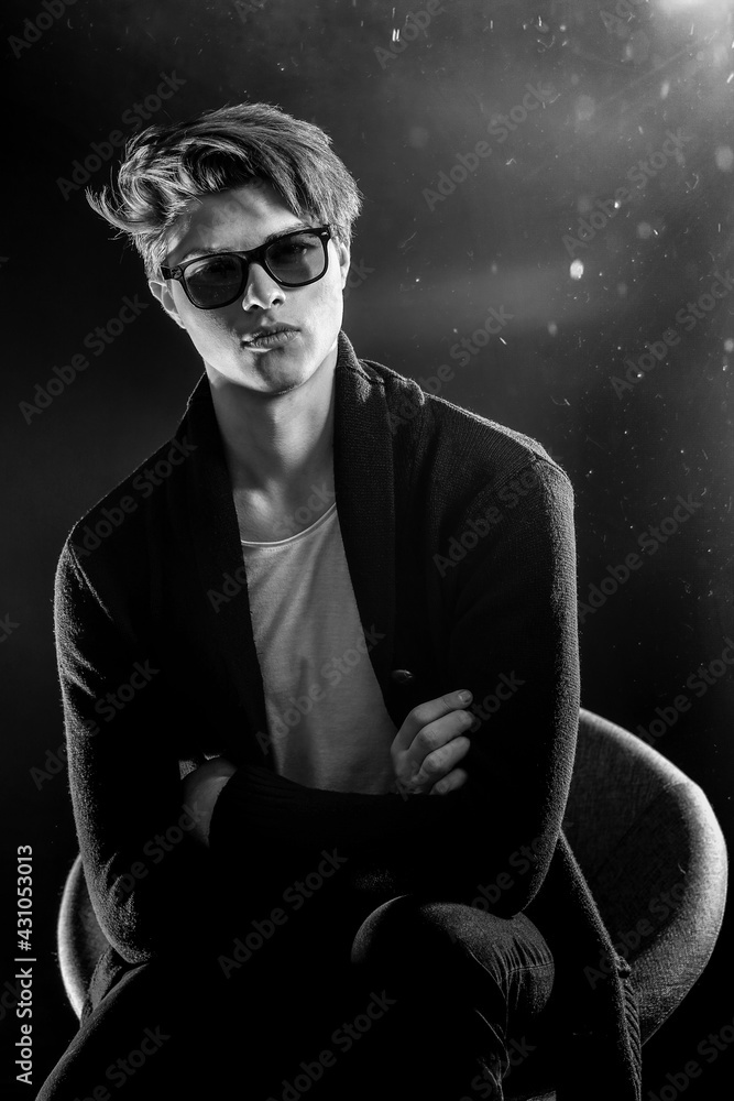 Fototapeta premium Cool stylish man in black jacket and sunglasses. High Fashion ma