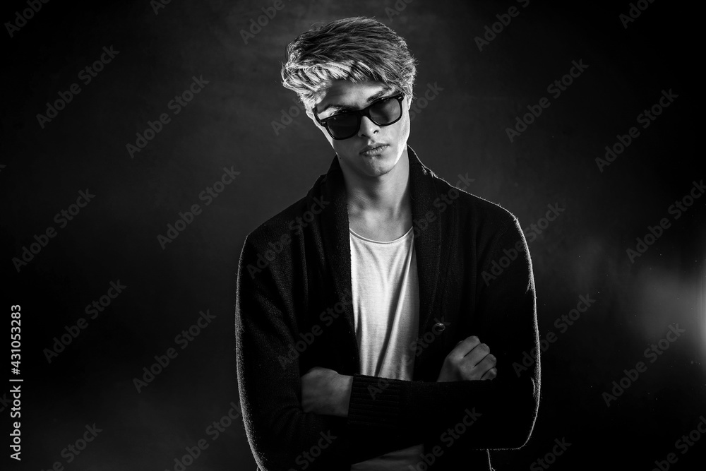 Fototapeta premium Cool stylish man in black jacket and sunglasses. High Fashion ma
