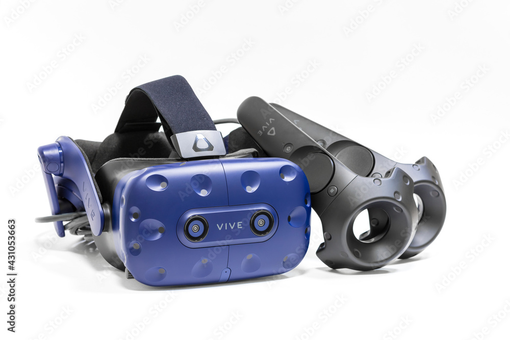 Khabarovsk, Russia - January 25, 2020: HTC Vive Pro virtual reality headset  with touch controllers. High-end device for virual reality games or  entertainment. Stock Photo | Adobe Stock