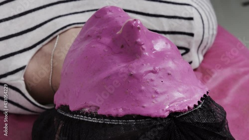 Wallpaper Mural Alginate mask application process. A female hands of a beautician holding spatula. The procedure for skin care in the beauty salon. Woman lying on a couch in the office of a beautician. Torontodigital.ca