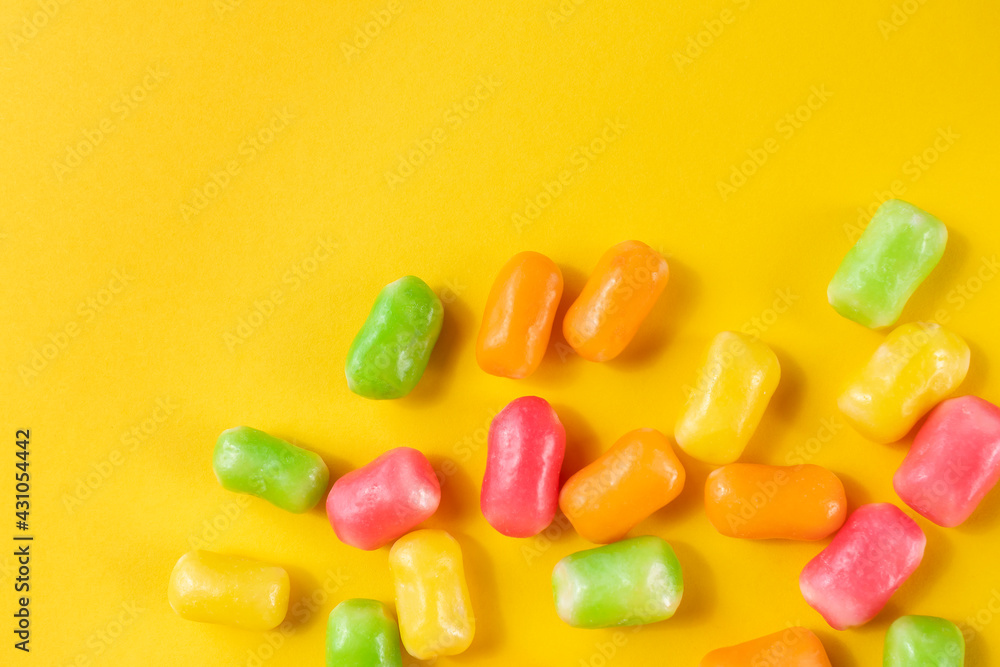 colorful candy on the yellow background. Flat lay with copy space. colorful candy on the yellow background. Flat lay with copy space.