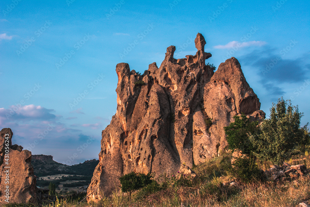 Fototapeta premium The wonderful geography of Phrygia. City of the Phrygians. Rocks, steppe and mountains. View of the Phrygian valley. Rock houses in the ancient city.