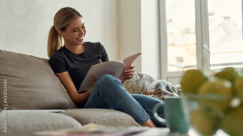 Picture of young woman who looks satisfied with working results Picture of young woman who looks satisfied with working results