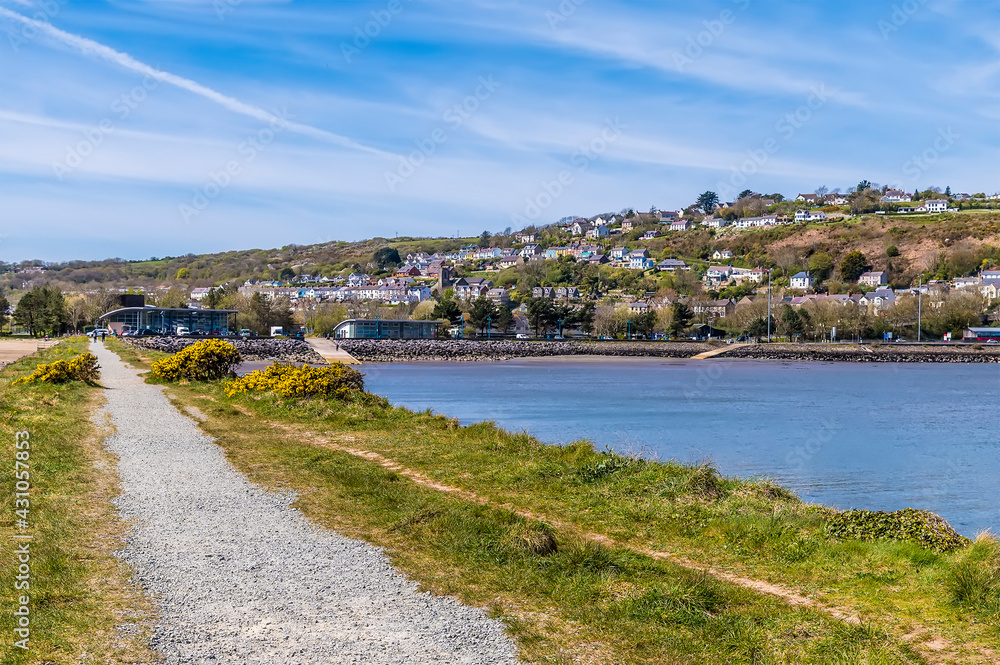 A view along the peninsula in the main bay at Fishguard, South Wales on a sunny day