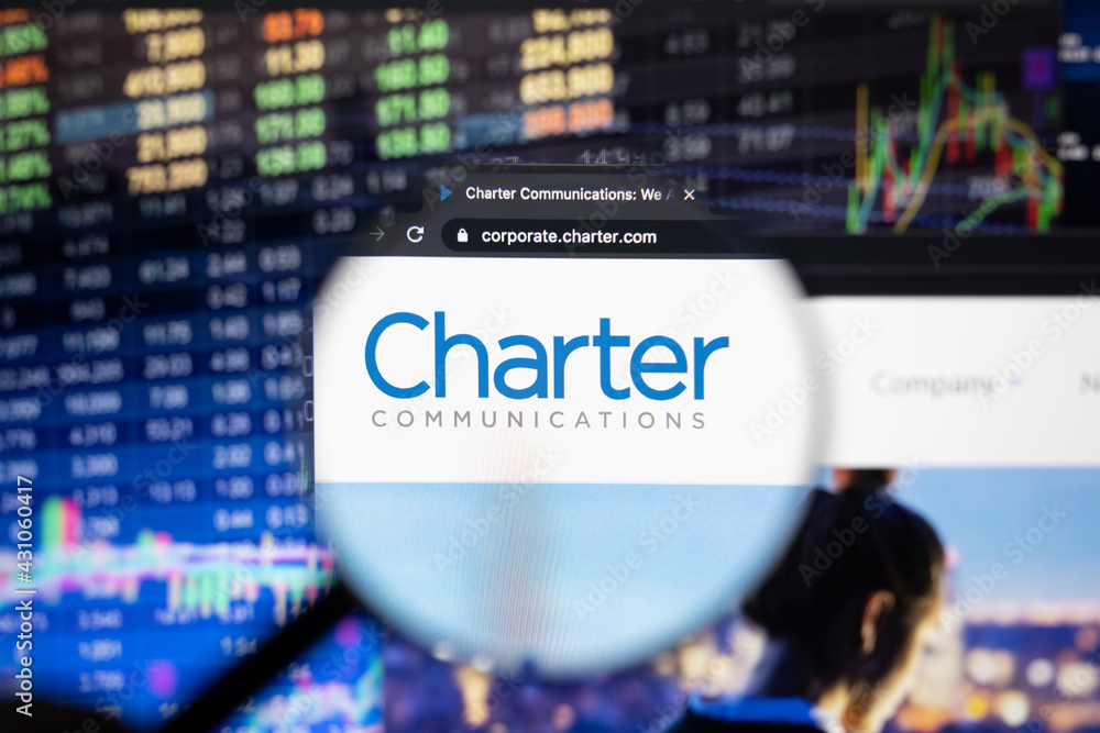 Charter Communications company logo on a website with blurry stock market  developments in the background, seen on a computer screen through a  magnifying glass 스톡 사진 | Adobe Stock