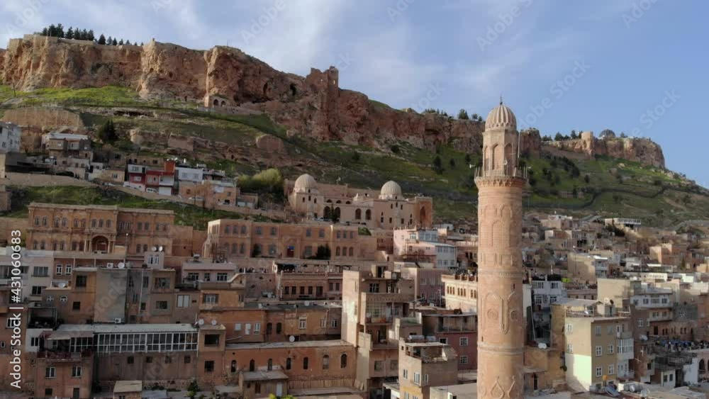 Aerial Drone shot of MARDIN city. The old city in Mezopotamia Located on the Slope of Mountain in Eastern Turkey Aerial Drone shot of MARDIN city. The old city in Mezopotamia Located on the Slope of Mountain in Eastern Turkey