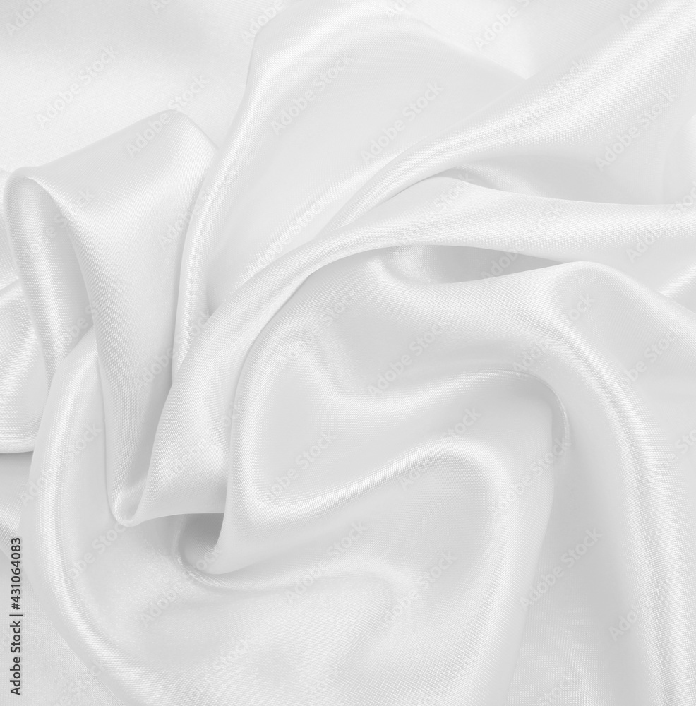 Smooth elegant white silk or satin luxury cloth texture as wedding background. Luxurious background design