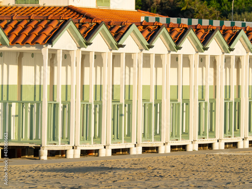 Traditional colorful wood beach cabin symbol of summer vacations