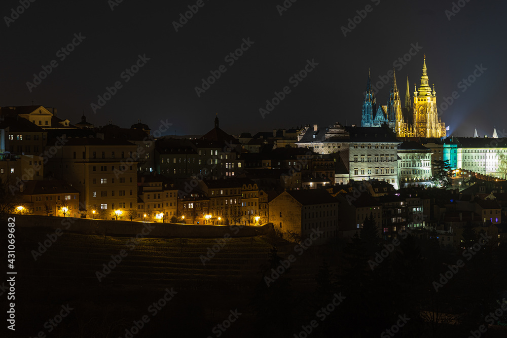 view of the world famous Prague Castle from the hill with a park next to it