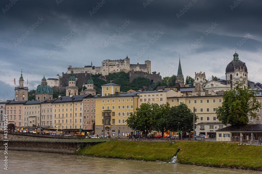 Fototapeta premium SALZBURG, AUSTRIA, 2 AUGUST 2020: Beautiful landscape of the Salzburg Castle and the Salzach River