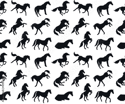 Vector seamless pattern of different hand drawn horse silhouette isolated on white background