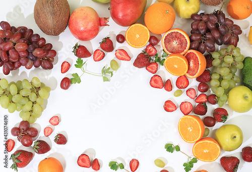 Fresh fruits and berries on a bright sunny table  a source of vitamins and antioxidants  ingredients for a healthy breakfast  detox diet and weight loss  natural and healthy food concept 