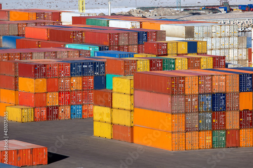 port warehouse of a container terminal with export cargo stockpiled at customs control stacks of multi-colored iron containers brokerage services, nobody. photo