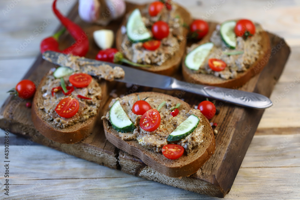 Sandwiches with pate on a wooden board. The keto diet. Sandwiches with pate on a wooden board. The keto diet.