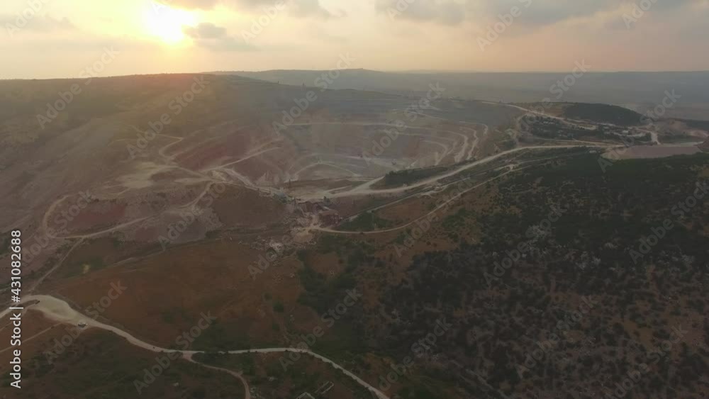 Aerial view of opencast mining quarry with lots of machinery at work Aerial view of opencast mining quarry with lots of machinery at work
