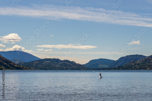 beautiful Skaha lake panorama with blue sky and white clouds summer morning