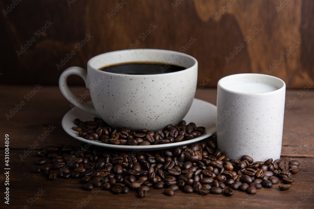 Coffe cup with milk and coffee grains Coffe cup with milk and coffee grains