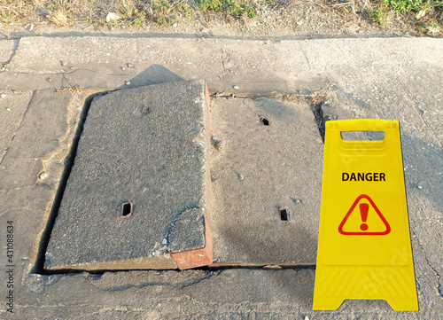 Grade separation of old concrete damaged sewer or drain pipe on sidewalk or footpath. Social problem concept. 