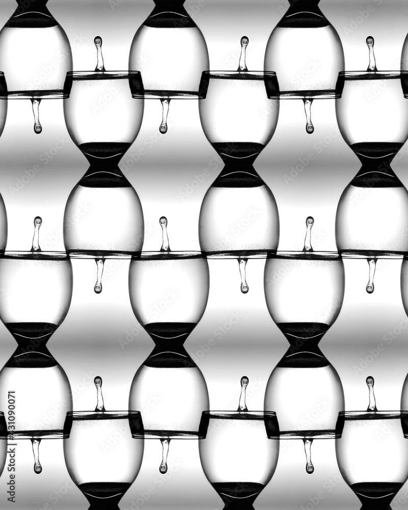 Abstract kaleidoscopic blend pattern of water drop splash in water in crystal wine glass Abstract kaleidoscopic blend pattern of water drop splash in water in crystal wine glass