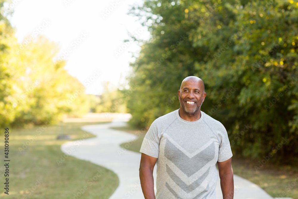 Mature African American man taking a walk outside. Mature African American man taking a walk outside.