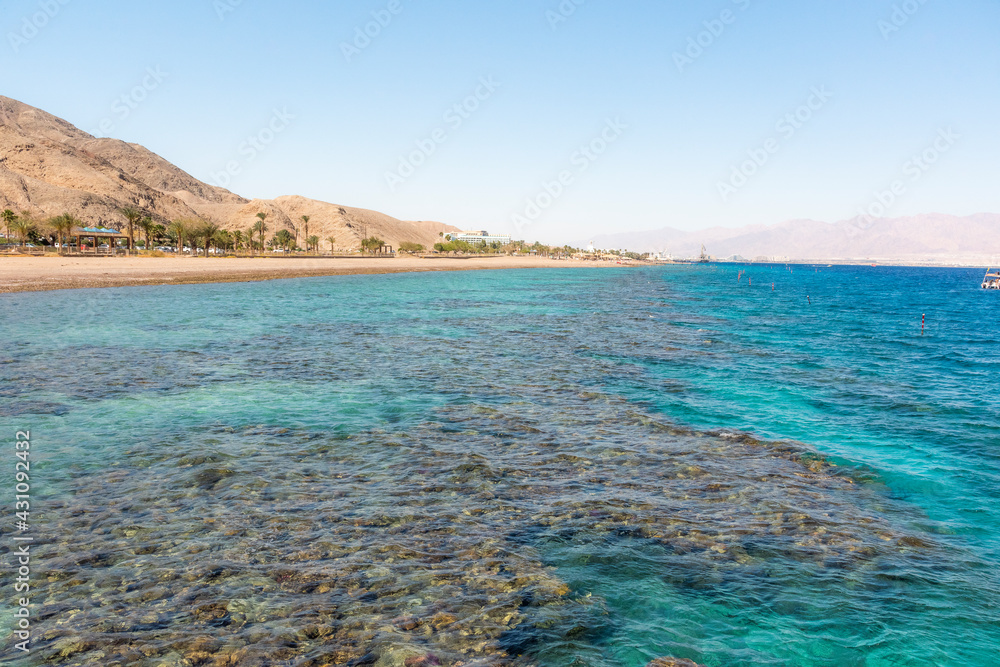 A view of the coral reef above the water. The Red Sea. Beach in the city of Eilat, Israel High angel. High quality photo