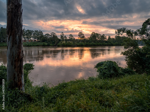 Beautiful Riverside Sunset with Dramatic Sky and Cloud Reflections