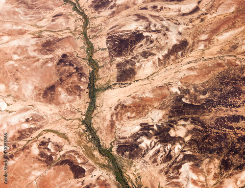 Tree lined dry creek in the arid land of central Australia