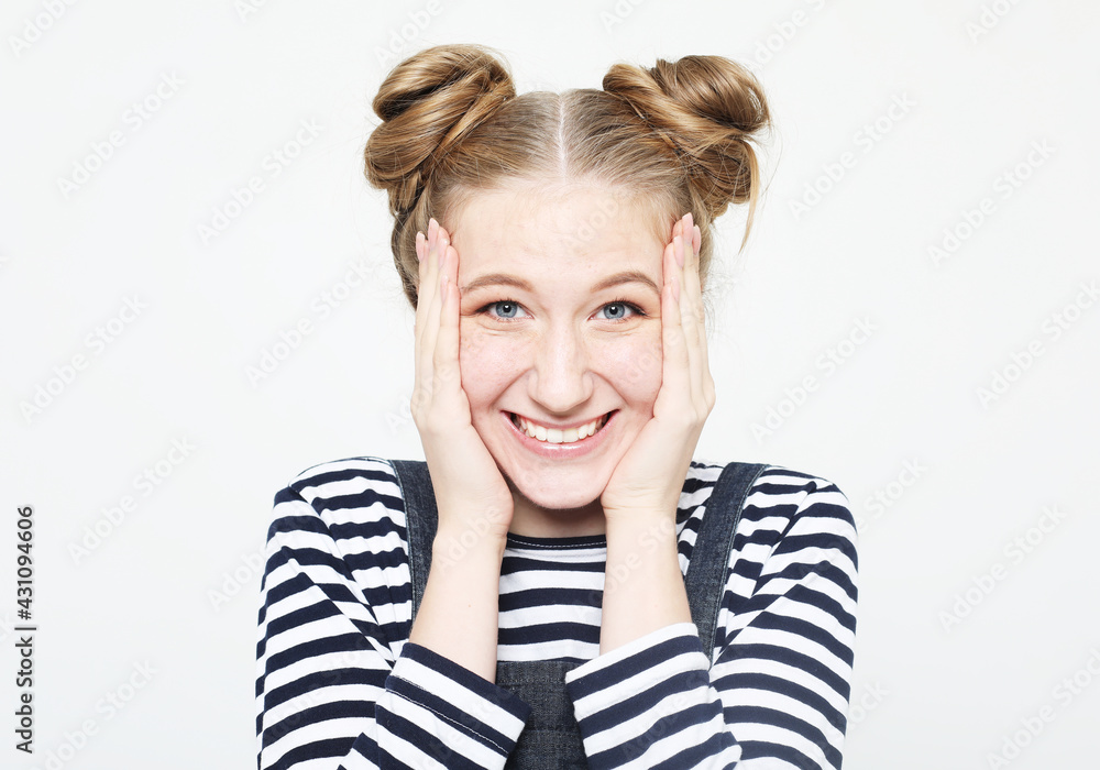 Lifestyle, emotion and people concept: Young surprised woman wearing casual Lifestyle, emotion and people concept: Young surprised woman wearing casual