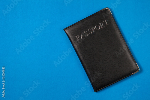 Passport on the blue background. Minimalism style. The concept of Travel and Holidays.