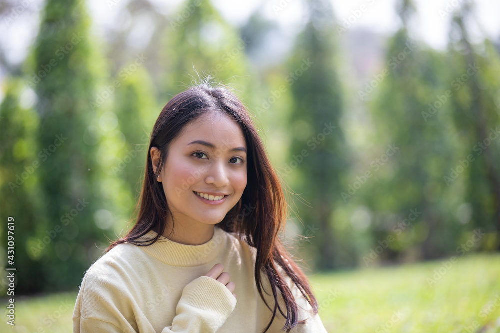 Beautiful Asian woman Smiling happy girl and wearing warm clothes winter and autumn portrait at outdoor in park Beautiful Asian woman Smiling happy girl and wearing warm clothes winter and autumn portrait at outdoor in park