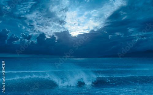 Moon rising over empty ocean at night, power sea wave in the foreground "Elements of this image furnished by NASA" © muratart