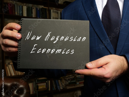 Financial concept meaning New Keynesian Economics  with sign on the black notepad. photo