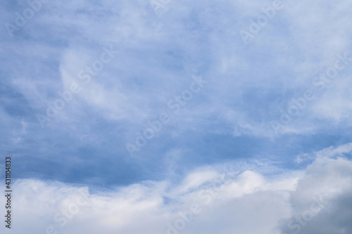 Fototapeta Naklejka Na Ścianę i Meble -  Abstract background of white fluffy clouds on a bright blue sky