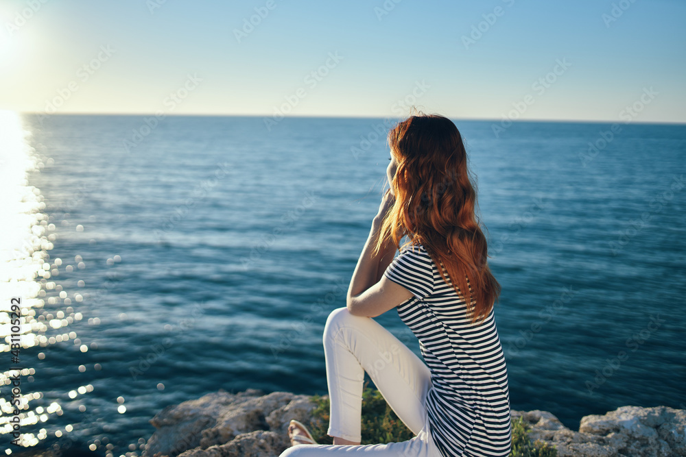 woman on the sea in the mountains in the evening at sunset high cliffs mountains woman on the sea in the mountains in the evening at sunset high cliffs mountains