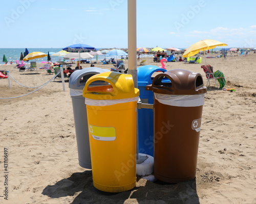 foure bins for separate waste collection on the beach of the Resort by the sea photo