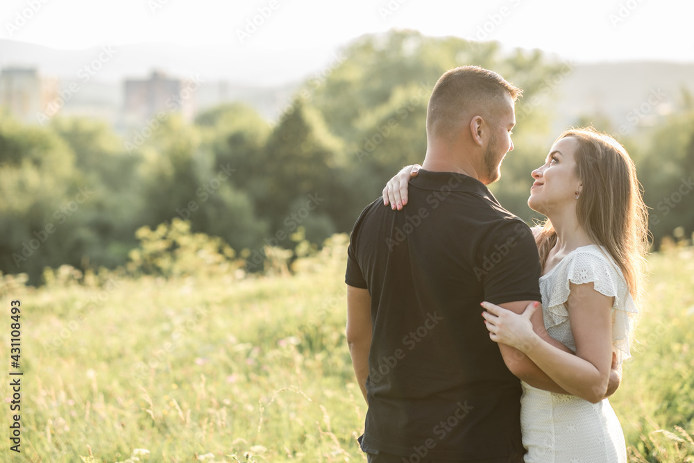 Couple lovers hugging and kissing in the park at sunset. Love, youth, happiness concept.
Couple lovers hugging and kissing in the park at sunset. Love, youth, happiness concept.