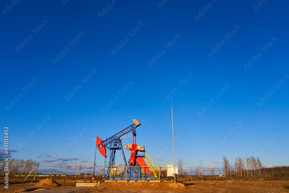 Oil drilling derricks at moutain oilfield for fossil fuels output and crude oil production from the ground