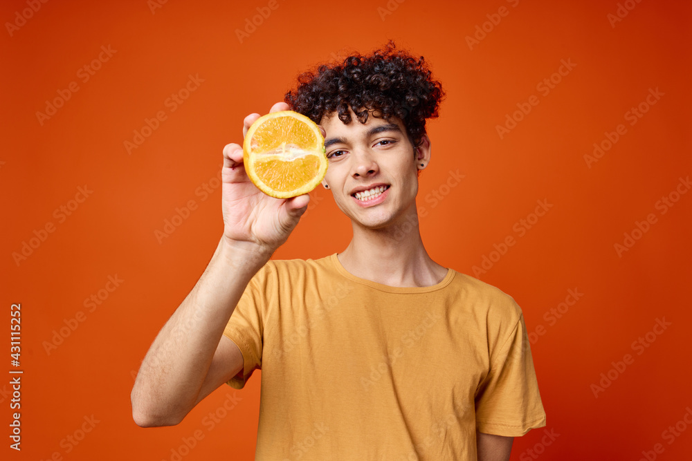 guy with curly hair oranges in hands fruit fun red background guy with curly hair oranges in hands fruit fun red background