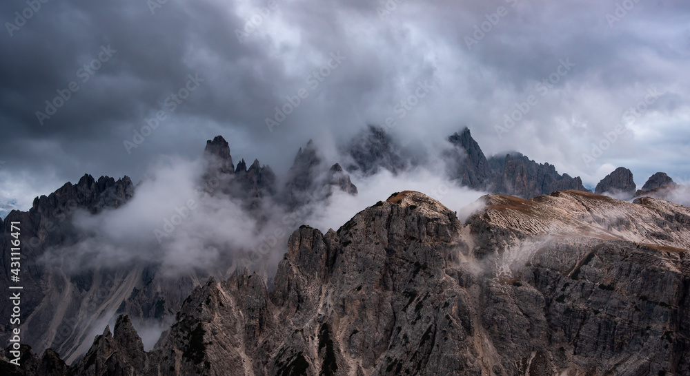 Mountain landscape with mist, at sunset. at Tre Cime di lavaredo, Italian dolomites a in South Tyrol in Italy.